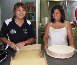 *Canteen capers: Master organiser Tien Ha (left) and Victoria Tran get cracking on dessert.